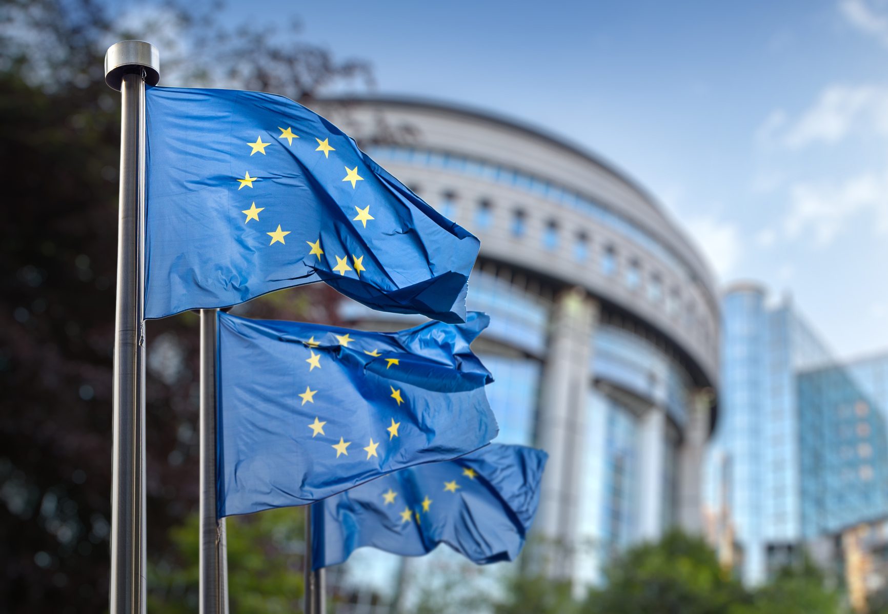 European union flag against parliament in Brussels, Belgium